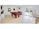 Spacious game room features a pool table, tile flooring, and access to the backyard at 3431 Iberia St, Las Vegas, NV 89146