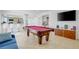 Game room with a pool table, a bar area, and a view of the kitchen at 3431 Iberia St, Las Vegas, NV 89146