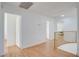 Bright upstairs hallway with wood floors and a gold railing with multiple doors and access points at 3431 Iberia St, Las Vegas, NV 89146