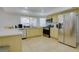 Bright kitchen with stainless steel appliances, light-colored cabinets, and ample counter space by a sunny window at 3431 Iberia St, Las Vegas, NV 89146