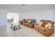 Comfortable living room featuring tile flooring and a view into dining area at 3431 Iberia St, Las Vegas, NV 89146