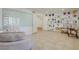 Inviting living room featuring custom built-in shelves, a large white board and comfortable seating at 3431 Iberia St, Las Vegas, NV 89146