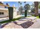 Outdoor patio with seating area overlooking a backyard pool and landscaping at 3431 Iberia St, Las Vegas, NV 89146
