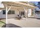 Covered patio with outdoor seating area, offering a comfortable space to enjoy the backyard view at 3431 Iberia St, Las Vegas, NV 89146
