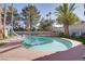 Outdoor pool area featuring a slide and lounge chairs, creating a relaxing and fun backyard oasis at 3431 Iberia St, Las Vegas, NV 89146