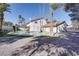 Backyard pool with a slide and brick patio, perfect for outdoor enjoyment and relaxation at 3431 Iberia St, Las Vegas, NV 89146