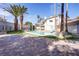 Backyard pool with slide and brick patio, perfect for outdoor enjoyment and relaxation at 3431 Iberia St, Las Vegas, NV 89146