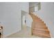 Elegant staircase featuring hardwood steps and a decorative gold railing leading to the upper level at 3431 Iberia St, Las Vegas, NV 89146
