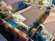 Aerial view of a backyard featuring a private pool, covered patio area, and mature landscaping at 351 Dandelion Brook Ct Ct, Las Vegas, NV 89148