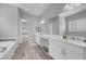 Bathroom featuring double sinks, soaking tub, walk-in shower, and walk-in closet at 351 Dandelion Brook Ct Ct, Las Vegas, NV 89148