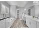 Bright bathroom featuring double sinks, soaking tub, walk-in shower, and walk-in closet at 351 Dandelion Brook Ct Ct, Las Vegas, NV 89148