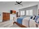 Bedroom with king size bed, wall mounted tv, and wood-style floors at 351 Dandelion Brook Ct Ct, Las Vegas, NV 89148