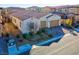 Well-kept single-story home featuring an attached two-car garage and manicured shrubbery at 351 Dandelion Brook Ct Ct, Las Vegas, NV 89148