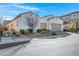 Well-maintained home featuring a two-car garage, desert landscaping, and a welcoming facade at 351 Dandelion Brook Ct Ct, Las Vegas, NV 89148
