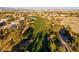 Beautiful aerial view of a lush green golf course with mature trees, sand traps, and a serene water feature at 351 Dandelion Brook Ct Ct, Las Vegas, NV 89148