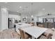 Open-concept kitchen with a center island, stainless steel appliances, and a seamless flow to the living area at 351 Dandelion Brook Ct Ct, Las Vegas, NV 89148