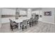 Contemporary kitchen boasts a spacious island with bar seating, perfect for entertaining guests at 351 Dandelion Brook Ct Ct, Las Vegas, NV 89148