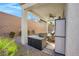 Covered patio area with lounge seating next to the pool at 351 Dandelion Brook Ct Ct, Las Vegas, NV 89148