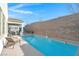 This house features a private swimming pool and covered patio at 351 Dandelion Brook Ct Ct, Las Vegas, NV 89148