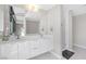 Modern bathroom with double vanity, large mirror, and glass-enclosed shower at 353 E Bonneville Ave # 752, Las Vegas, NV 89101