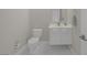 Clean and modern half-bath with white fixtures, a minimalist vanity, and neutral wall color at 353 E Bonneville Ave # 752, Las Vegas, NV 89101
