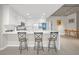 Modern kitchen featuring sleek white cabinetry, a large island, and open seating at the counter at 353 E Bonneville Ave # 752, Las Vegas, NV 89101