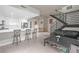 Bright, open-concept living space featuring modern kitchen, dining area, and staircase at 353 E Bonneville Ave # 752, Las Vegas, NV 89101