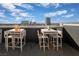 Chic rooftop terrace featuring intimate dining setups with city views, perfect for entertaining at 353 E Bonneville Ave # 752, Las Vegas, NV 89101