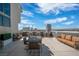 Expansive rooftop terrace with stylish patio furniture and a stunning city skyline view at 353 E Bonneville Ave # 752, Las Vegas, NV 89101