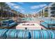 Resort-style swimming pool with palm trees and a modern fire pit, offering a relaxing outdoor space at 353 E Bonneville Ave # 752, Las Vegas, NV 89101