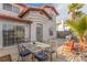 Enclosed backyard offering outdoor dining, with a grill, table and desert landscaping at 3866 Starfield Ln, Las Vegas, NV 89147