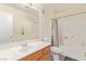 Functional bathroom featuring a vanity with wood cabinets and tub and shower combo at 3866 Starfield Ln, Las Vegas, NV 89147