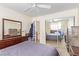 Large bedroom featuring sliding closet doors, dresser, and neutral decor at 3866 Starfield Ln, Las Vegas, NV 89147