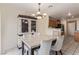 Dining area with tile floors and a dining table with light-colored chairs at 3866 Starfield Ln, Las Vegas, NV 89147