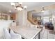 Bright dining area featuring a large table, chandelier, and access to the living room, creating an open and inviting space at 3866 Starfield Ln, Las Vegas, NV 89147