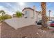 Beige stucco house with a red clay roof with a car in the driveway at 3866 Starfield Ln, Las Vegas, NV 89147