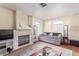 Living room with hardwood floors, fireplace, a large area rug, and plentiful light at 3866 Starfield Ln, Las Vegas, NV 89147