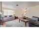 Living room featuring hardwood floors, a large area rug, and plenty of seating at 3866 Starfield Ln, Las Vegas, NV 89147