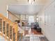 Hardwood entryway with a staircase and a view into the carpeted living room at 3866 Starfield Ln, Las Vegas, NV 89147