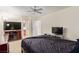 Comfortable main bedroom featuring two dressers, a ceiling fan, and an en-suite bathroom, providing ample storage and privacy at 3866 Starfield Ln, Las Vegas, NV 89147