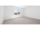 Bright and spacious bedroom with plush carpet and a large window offering plenty of natural light at 4485 E Brusca Way, Pahrump, NV 89061