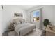 Bright bedroom featuring neutral tones, large window, and stylish decor, creating a serene and inviting atmosphere at 4485 E Brusca Way, Pahrump, NV 89061