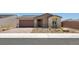 Charming single-story home with a two-car garage and desert landscaping at 4485 E Brusca Way, Pahrump, NV 89061