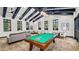 Inviting game room with a pool table, comfortable seating, and ample natural light at 4485 E Brusca Way, Pahrump, NV 89061