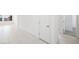 Bright hallway featuring tiled flooring and multiple doorways at 4485 E Brusca Way, Pahrump, NV 89061