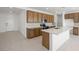 A spacious kitchen features an island, stainless steel appliances, and ample cabinet space at 4485 E Brusca Way, Pahrump, NV 89061