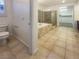 Elegant bathroom featuring a soaking tub, separate shower, and tile flooring and walk in closet at 7719 Windy Meadow Ave, Las Vegas, NV 89178