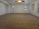 Large, bright bedroom with neutral carpet, plantation shutters, and plenty of open space at 7719 Windy Meadow Ave, Las Vegas, NV 89178