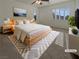 Well-lit, virtually staged bedroom with neutral tones, soft textures, and a relaxing ambiance at 7719 Windy Meadow Ave, Las Vegas, NV 89178