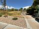 Sidewalk through community park with mature trees and green space at 7719 Windy Meadow Ave, Las Vegas, NV 89178